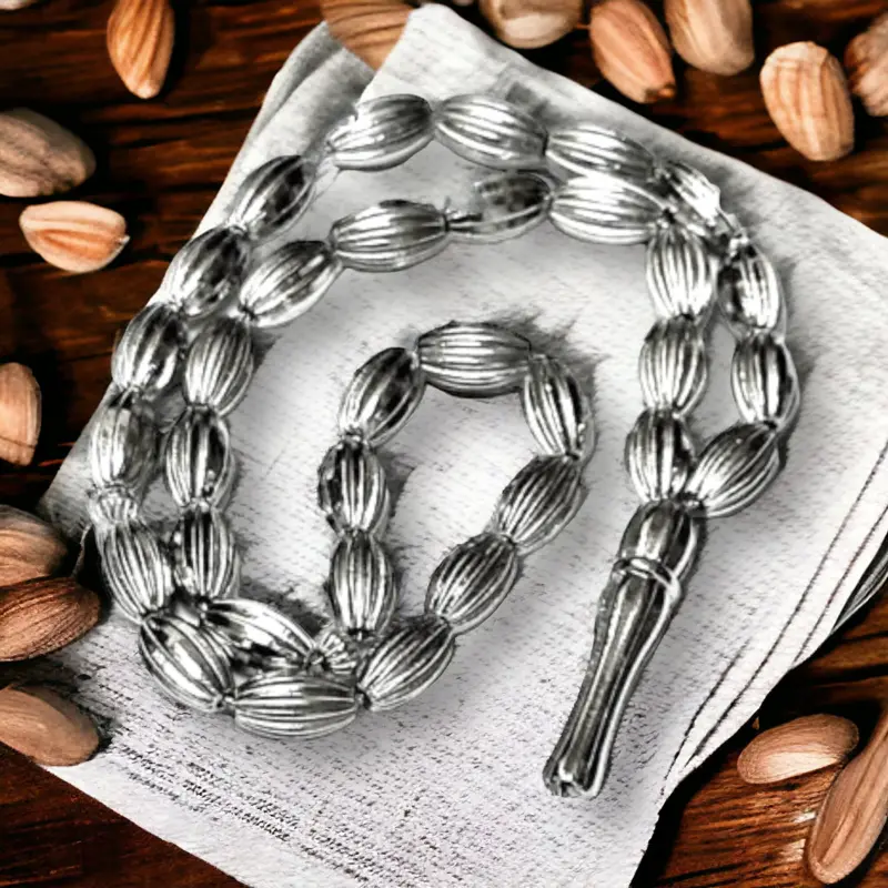 Tasbih i metal i mandellformet perler, 33 perler